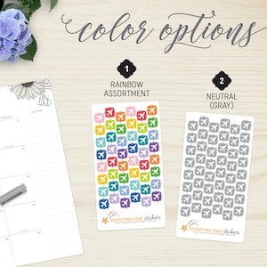 May include: Two sticker sheets with airplane designs. One sheet features a rainbow assortment of colourful airplanes, while the other displays neutral grey airplanes. The text "color options" is at the top. The stickers are from "Shooting Star Stickers".