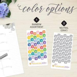May include: Two sticker sheets with shopping cart designs. One sheet features a rainbow assortment of colourful carts, while the other displays grey carts. The text "color options" is at the top. The brand name "Shooting Star Stickers" is at the bottom.