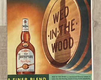 May include: A vintage advertisement for Old Thompson Blended Whiskey. The ad features a bottle of whiskey and a large wooden barrel with the text "Wed in the Wood". The text "A Finer Blend from Old Kentucky" is also featured in the ad.