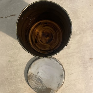 May include: A silver metal container with a brown wooden interior. The container is open and the wooden interior is visible.