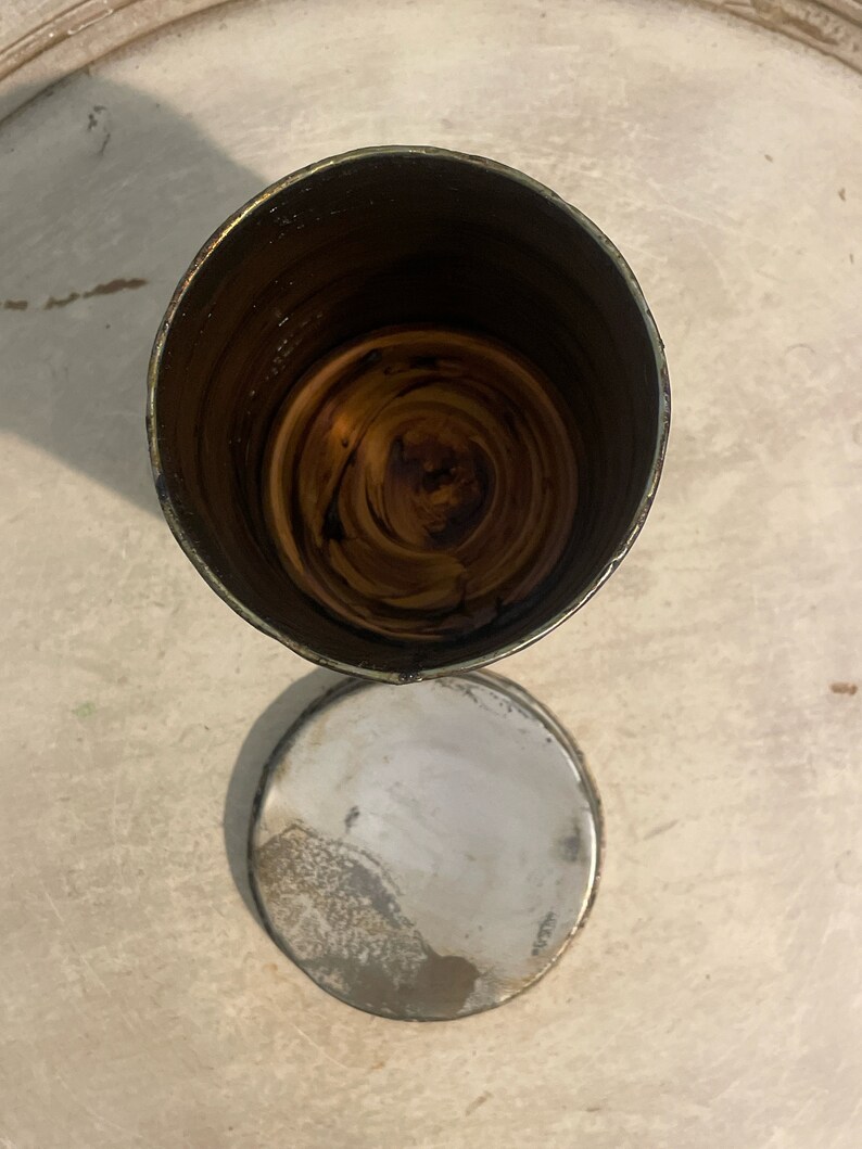 May include: A silver metal container with a brown wooden interior. The container is open and the wooden interior is visible.