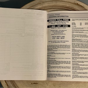 May include: A page from a Corvette World catalog with ordering information. The page includes a toll-free number, a tech info line number, and details about ordering, shipping, and returns.