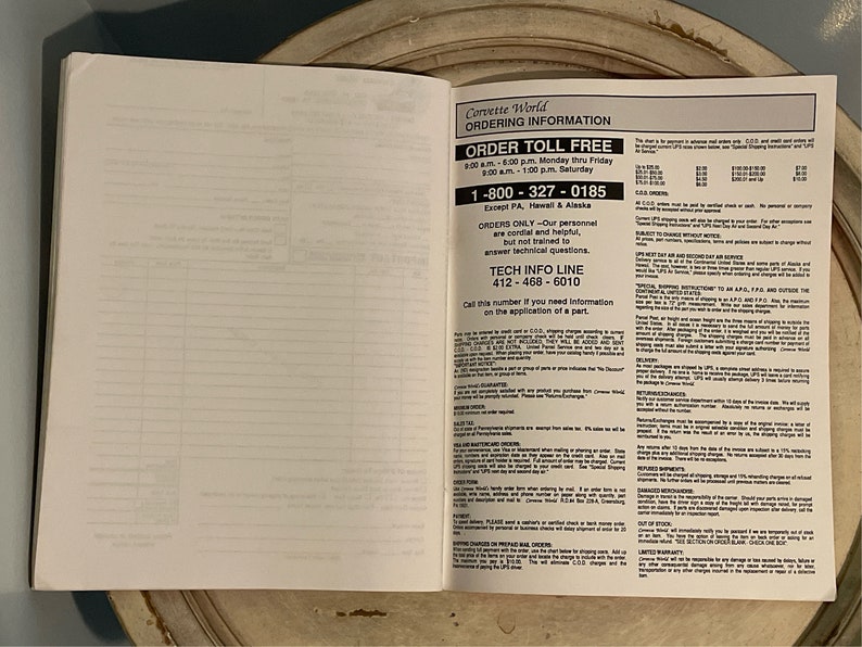 May include: A page from a Corvette World catalog with ordering information. The page includes a toll-free number, a tech info line number, and details about ordering, shipping, and returns.