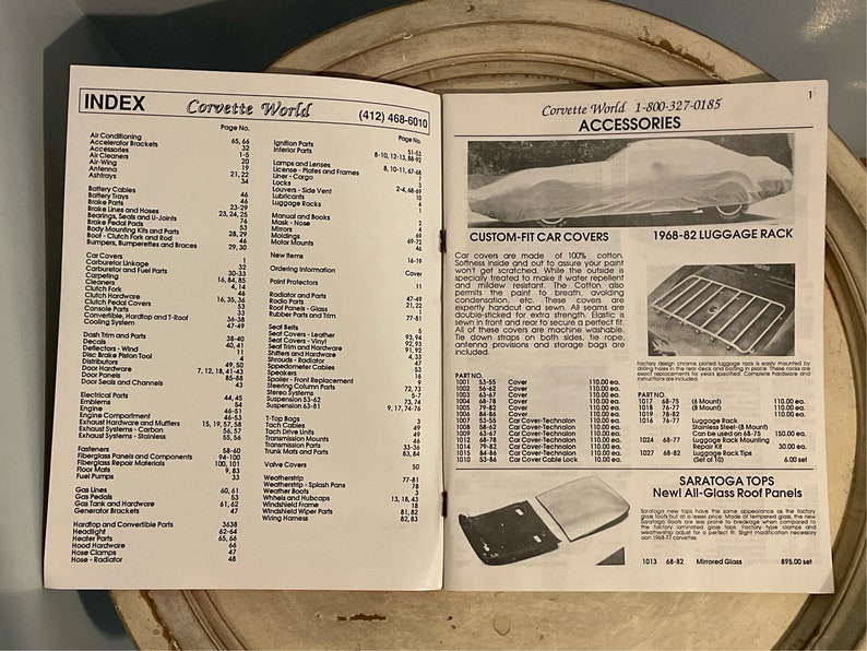 May include: A black and white catalog page for Corvette World, featuring a selection of car accessories. The page includes a section on custom-fit car covers, a 1968-82 luggage rack, and Saratoga Tops new all-glass roof panels. The catalog page also includes an index with a list of parts and their corresponding page numbers.