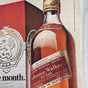 May include: A bottle of Johnnie Walker Red Label Scotch Whisky, imported by Canada Dry Corp. The bottle is labeled with the brand name, "Red Label", and "Bottled in Scotland".