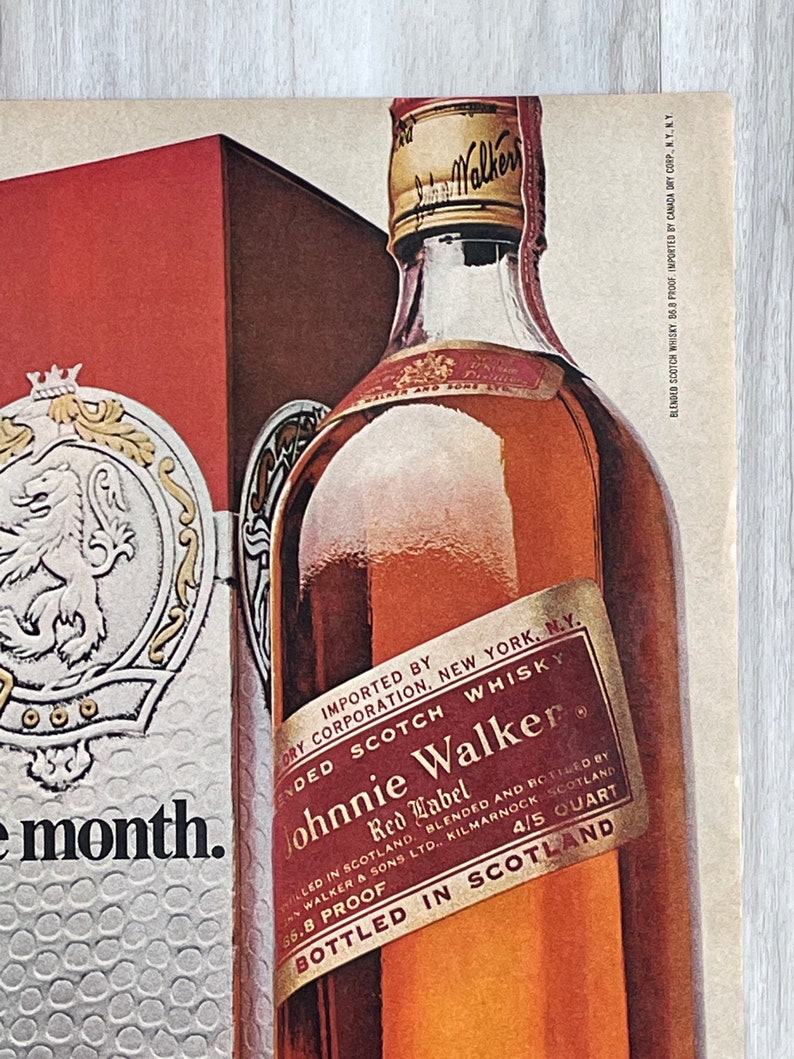 May include: A bottle of Johnnie Walker Red Label Scotch Whisky, imported by Canada Dry Corp. The bottle is labeled with the brand name, "Red Label", and "Bottled in Scotland".