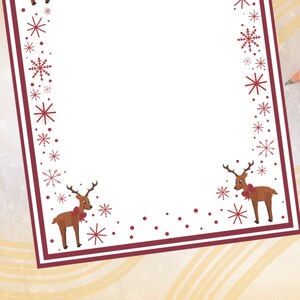 May include: A white stationery sheet with a burgundy border, adorned with snowflakes and reindeer illustrations. A yellow pencil rests on the surface. The design is festive, suitable for holiday-themed notes or letters.