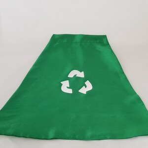 May include: Green fabric cape with a white recycle symbol printed on the front.