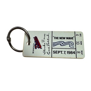 May include: A vintage Minnesota Twins baseball ticket keychain. The ticket features the team logo, the text "THE NEW WAVE", and the date September 7, 1984. Includes a metal ring for attaching to keys.