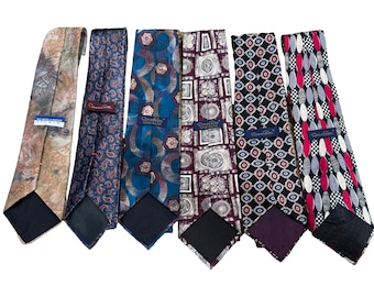 May include: A set of six patterned silk ties in various colors, including brown, blue, red, and black. The ties are all made by the same brand, "Don Roberto".