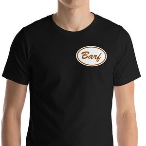 May include: A black t-shirt with a white oval patch that says "Barf" in brown lettering.