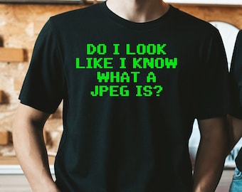 May include: Two people wearing black t-shirts with green text that reads "Do I look like I know what a JPEG is?"