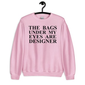 Las bolsas bajo mis ojos son sudadera unisex de diseñador - bolsos de diseñador, moda, sudadera de moda, moda divertida, cita de bolso Estrés