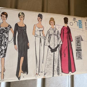 May include: A vintage Vogue pattern envelope showing illustrations of five dresses. The designs include a black gown with a thigh-high split, a white dress with a bow, and a red coat. The envelope has the text "Vogue Special Design".
