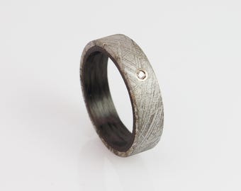 Carbon ring with meteorite and diamond