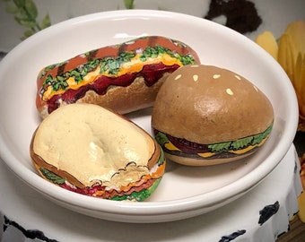Painted rocks, hamburger, fries, hotdog, pizza, breakfast burrito
