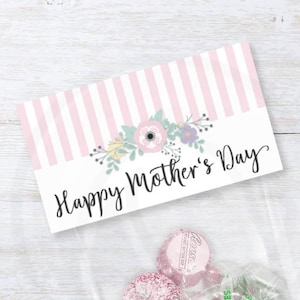 May include: Printable gift bag topper with pink and white stripes and a floral design. The text "Happy Mother's Day" is printed on the topper. Two sizes are included: 4 inches and 6.5 inches.