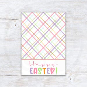 Puede incluir: Una tarjeta blanca con un patrón de cuadros en rosa, morado, verde y amarillo. La tarjeta tiene el texto "¡Feliz Pascua!" en letras de colores.