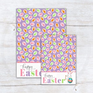 May include: Two Easter-themed cards with a purple background covered in colorful paw prints. The larger card has the words "happy Easter" in pink and green. The smaller card features a bunny painting an Easter egg.