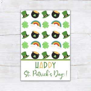 以下が含まれることがあります： 白い背景に、緑のレプラコーンの帽子、金の鍋、虹、クローバーの繰り返し模様が描かれた、聖パトリックの日のグリーティングカード。「Happy St. Patrick's Day!」の文字は緑とオレンジで書かれています。