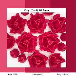 May include: A selection of ruby-red 3D roses, some fully open, others in bud. The image includes the text "Ruby (Dark) 3D Roses". The background displays a gradient of pink shades. The roses appear to be made of a soft material.