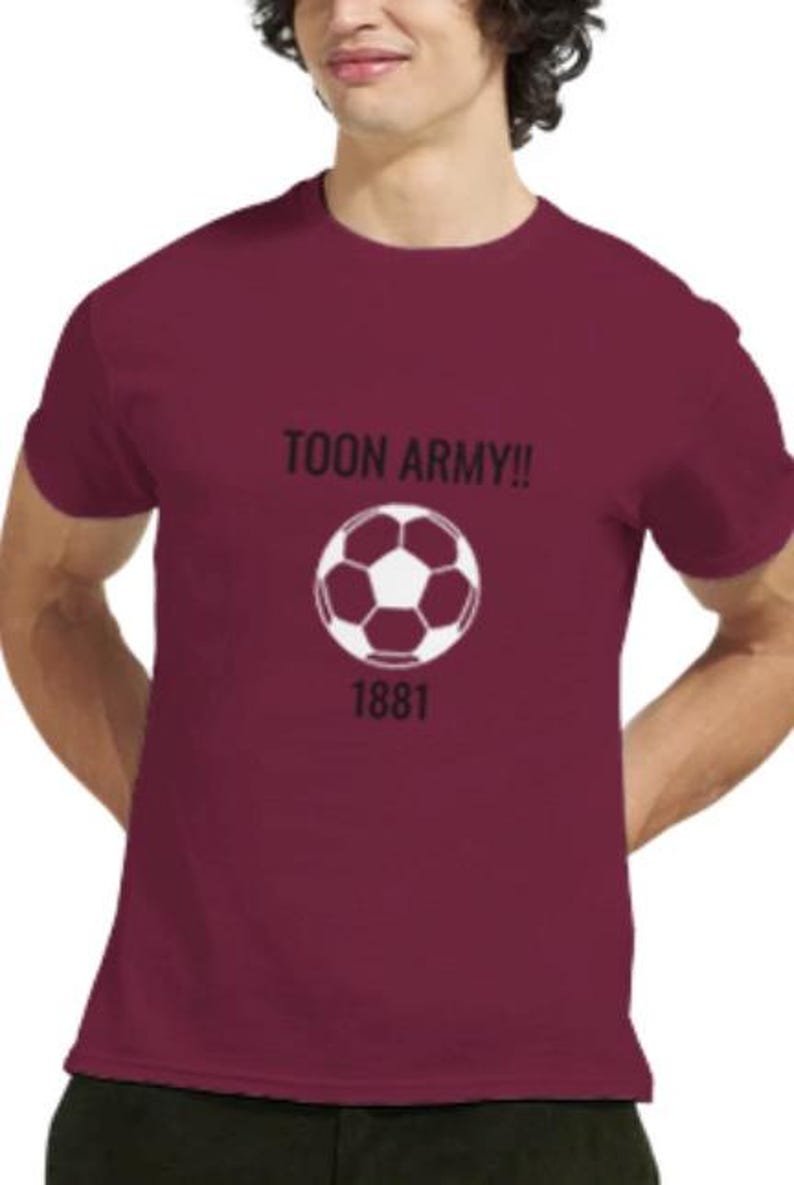 May include: Maroon t-shirt featuring a white football graphic and the text "TOON ARMY!!" above it. The number "1881" is below the football. The shirt is a solid maroon colour.