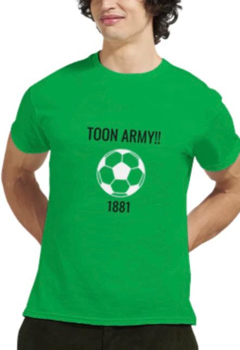May include: A green t-shirt featuring the text "TOON ARMY!!", a white and black football graphic, and the number "1881". The shirt is a solid green colour.