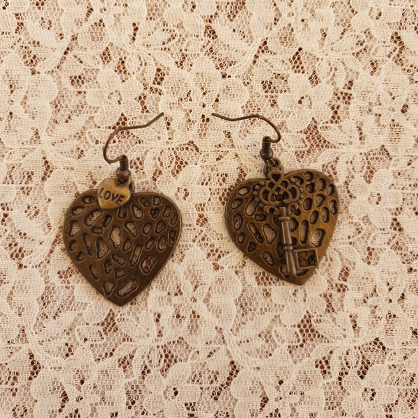 Bronze earrings with heart and key charms