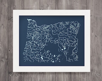 May include: A navy blue framed print of a white line drawing of the river systems of Oregon.