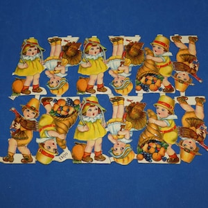 May include: A sheet of die-cut paper decorations featuring repeating illustrations of children in yellow outfits and pilgrim hats. The figures are depicted holding turkeys or cornucopias filled with fruit. The number 6041 is printed on one figure.