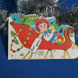 Vintage Children's Christmas Card 1960's Doubl Glo Raggedy Ann in a Sleigh Glitter Unused