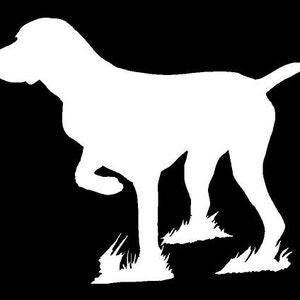 May include: A white silhouette of a dog standing on a black background. The dog is facing to the left and has its tail raised. The dog's legs are bent and its paws are visible.