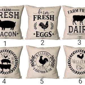 May include: Six different farmhouse themed throw pillow designs. The pillows are beige with black text and images. The designs include a pig, a rooster, a cow, and a wreath. The text on the pillows includes "Farm Fresh Bacon", "Farm Fresh Eggs", "Farm Fresh Dairy", "Home Sweet Home", "Welcome to Our Farmhouse", and "Welcome".