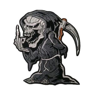 May include: An embroidered patch featuring a grim reaper character wearing a dark gray hooded robe. The figure has a skeletal face, holds a scythe with a brown handle, and is gesturing with a raised middle finger. The design uses black, white, gray, and brown thread.