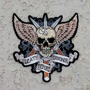May include: Black and white embroidered patch with a skull with wings and crossed swords. The text "Death Before Dishonor" is on a banner below the skull.