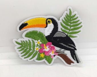 Toucan sitting on fern plant with tropical flowers embroidered iron-on patch island exotic bird yellow tiki patches