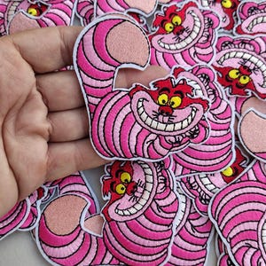 Pink and white striped Cat Embroidered Iron on Smiling Pink animated cartoon Cat