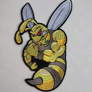 May include: Embroidered patch featuring a muscular, anthropomorphic bee with yellow and black stripes. The bee has a determined expression with red eyes and clenched fists, and large silver wings. The patch is on a white background.