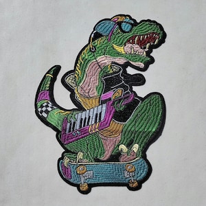 May include: A green dinosaur wearing a blue and black hat and sunglasses is playing a keyboard while riding a skateboard. The dinosaur is wearing a gold belt and a pink and black shirt.