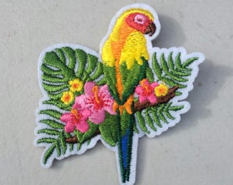 Parrot sitting on fern plant with tropical flowers embroidered iron-on patch island exotic bird yellow tiki patches