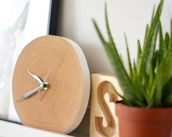 Clock made of wood - a slice of wood, a wooden wall clock, minimalism, Scandinavian style, a wooden slice