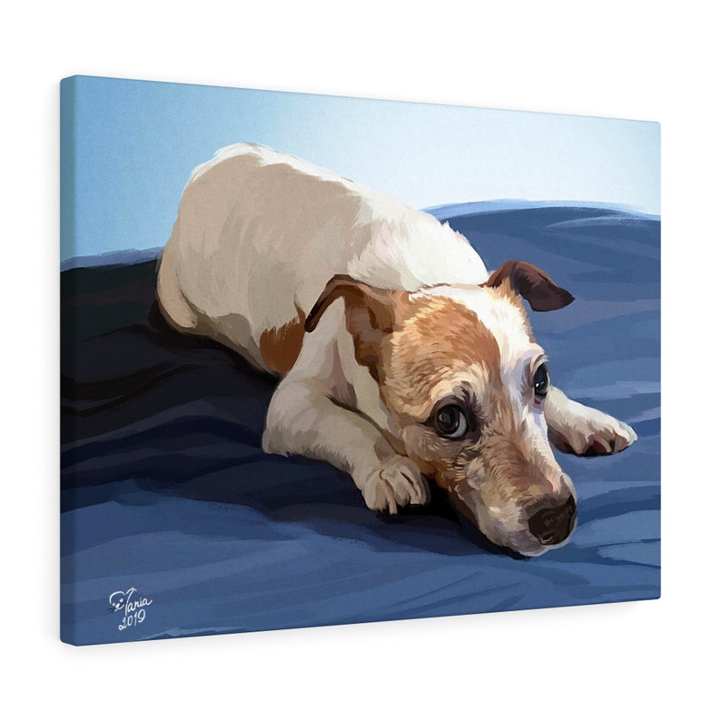 May include: A canvas print featuring a Jack Russell Terrier dog. The dog is depicted lying down on a blue surface, with a white and brown coat. The artwork is signed "Tania 2019" in the bottom left corner. The background is a gradient of blue.