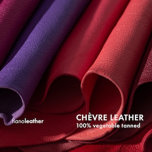May include: Close-up of several pieces of red and purple leather, showing the texture and grain. The text "CH&Egrave;VRE LEATHER 100% vegetable tanned" is visible at the bottom of the image.