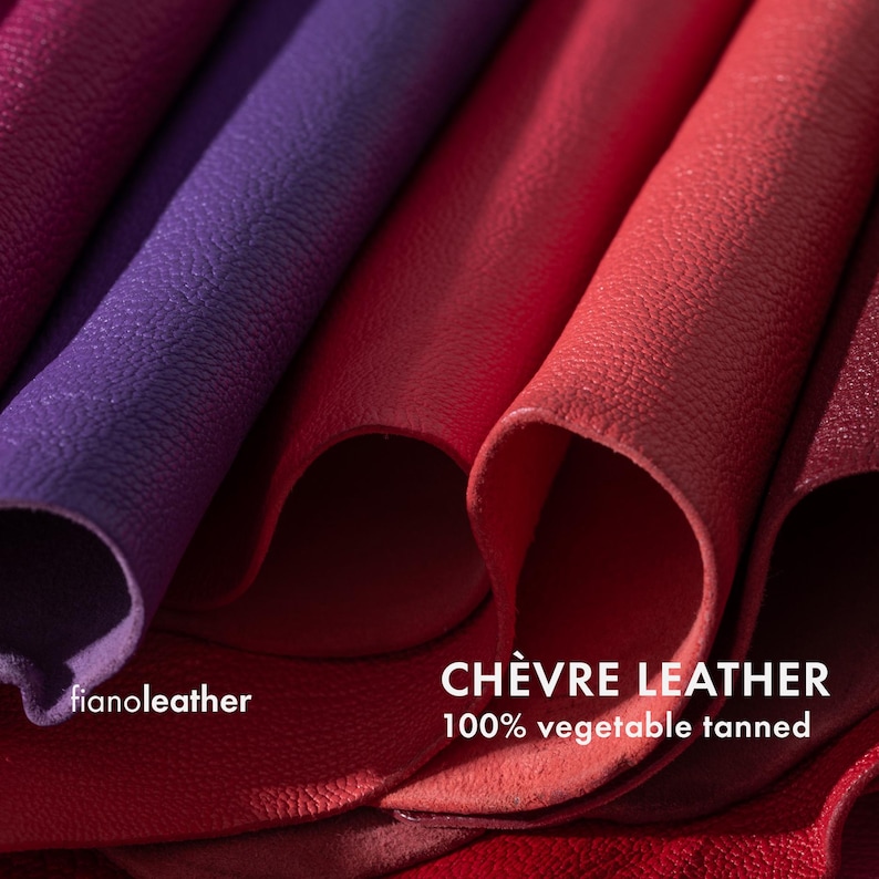 May include: Close-up of several pieces of red and purple leather, showing the texture and grain. The text "CH&Egrave;VRE LEATHER 100% vegetable tanned" is visible at the bottom of the image.