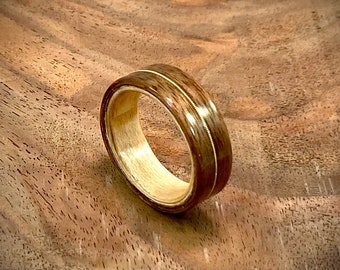 Walnut and maple handmade bentwood ring with guitar string inlay