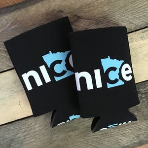 May include: Two black neoprene can coolers with the word "nice" in white text and a blue outline of the state of Minnesota with a "C" inside.