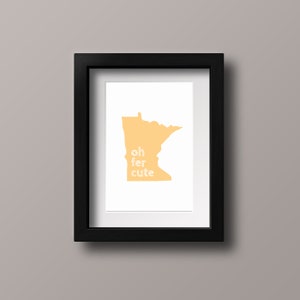 May include: A framed print featuring a yellow outline of the state of Minnesota with the text "oh fer cute" inside the outline.