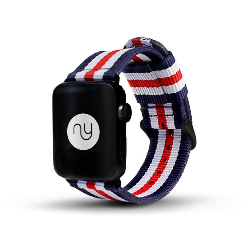 May include: A red, white, and blue striped watch band with a black watch face. The watch face has a white circle with the letters "NY" in it.