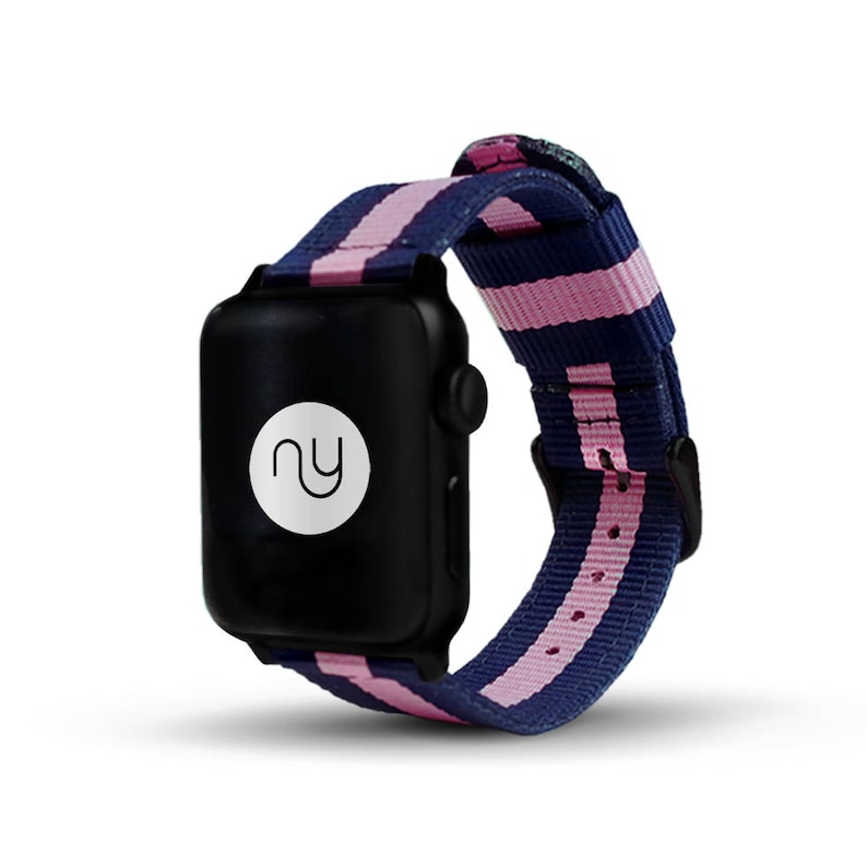 May include: A black Apple Watch with a pink and navy blue striped nylon band. The band has a white logo with the letters "NY" inside a circle.
