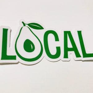 May include: Green sticker with the word "LOCAL" in white letters and a green avocado illustration.